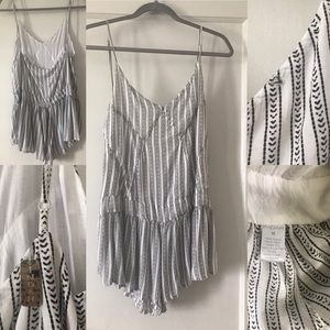 Indah Romper Size Medium flaw shown in top right